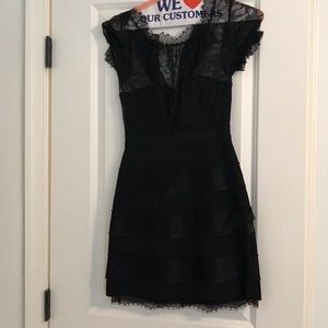 Black cocktail dress with lace top.